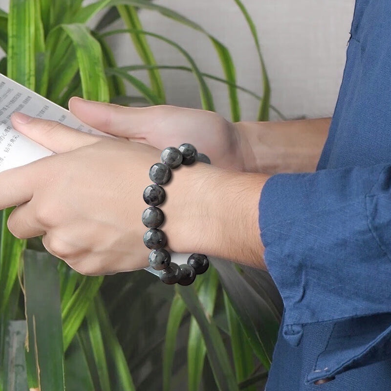 BoxUnboxed Maison Natural Black Jadeite Beaded Bracelet with 13mm spheres, charcoal-to-black depth, and smoky pattern.