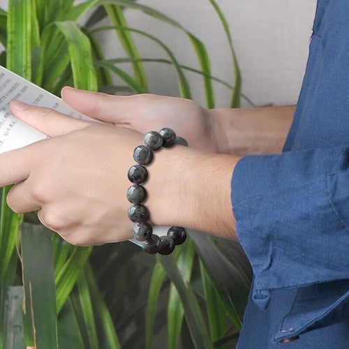 BoxUnboxed Maison Natural Black Jadeite Beaded Bracelet with 13mm spheres, charcoal-to-black depth, and smoky pattern.