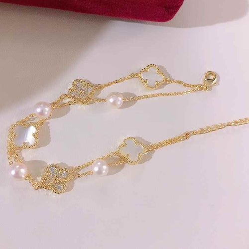 BoxUnboxed Classic Clover Double-Layer Pearl Bracelet with gold-plated finish, white freshwater pearls, and clover charms.