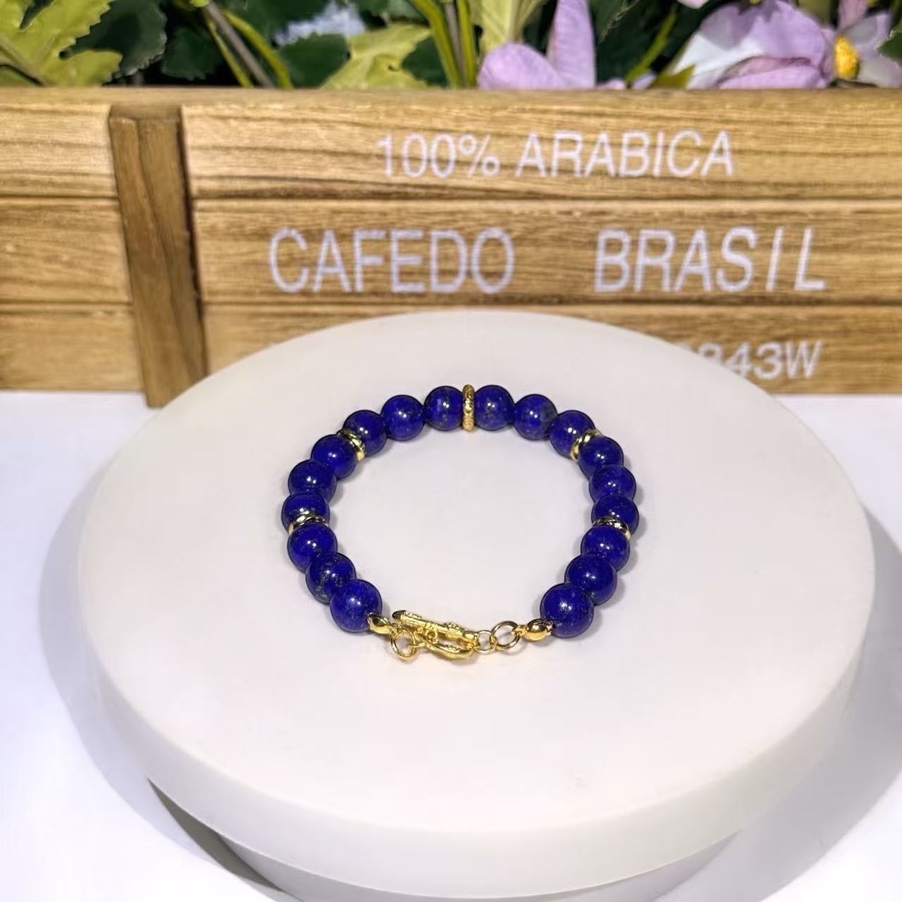 BoxUnboxed Afghan Lapis Lazuli bracelet with deep blue beads, gold-plated spacers, and a gold OT toggle clasp.