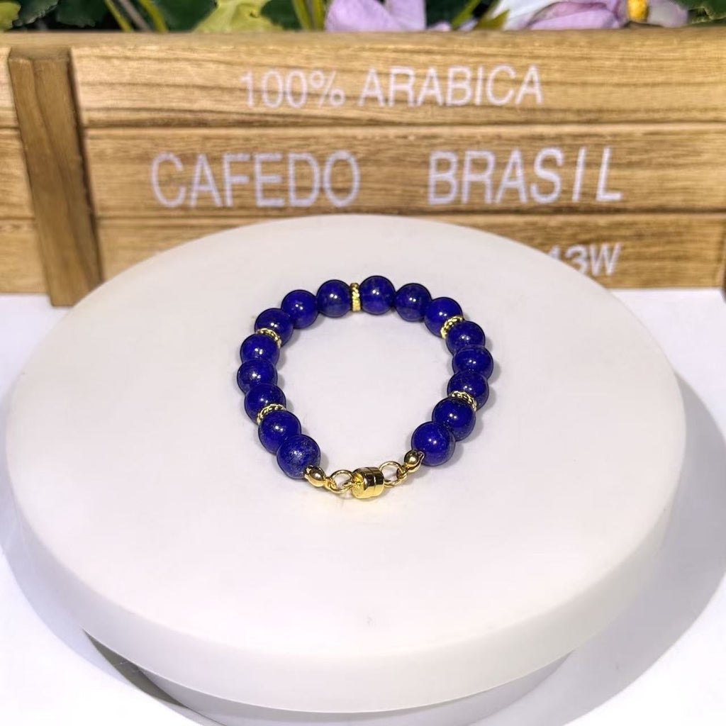 BoxUnboxed Afghan Lapis Lazuli bracelet with deep blue beads, gold-plated spacers, and a gold magnetic clasp.