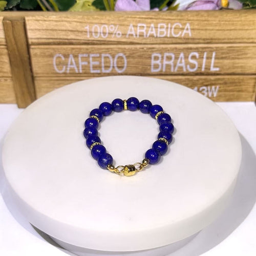 BoxUnboxed Afghan Lapis Lazuli bracelet with deep blue beads, gold-plated spacers, and a gold magnetic clasp.