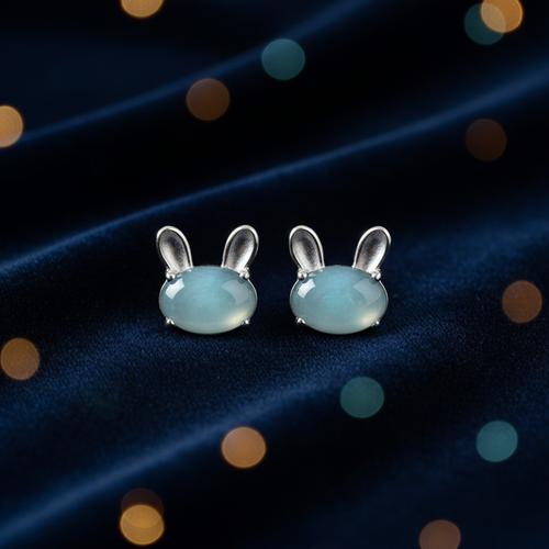 Natural blue water jadeite lunar rabbit stud earrings flat lay on dark velvet — luxury gift presentation, BoxUnboxed